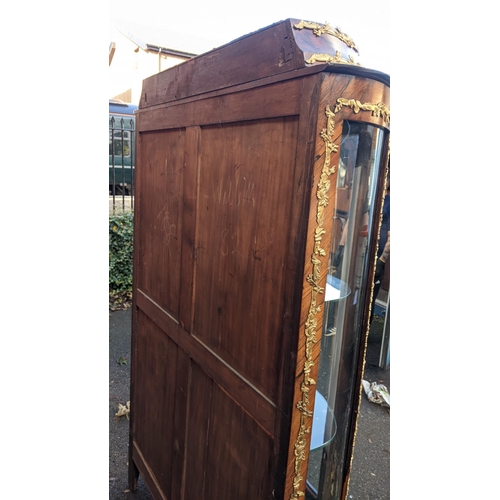 236 - A 19th century French Louis XV style kingwood vitrine display cabinet, serpentine fronted with twin ... 