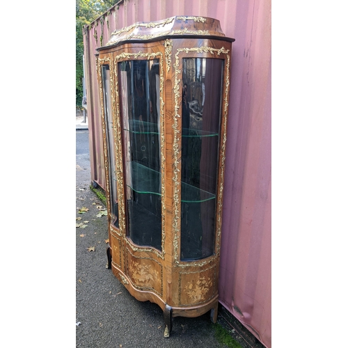 236 - A 19th century French Louis XV style kingwood vitrine display cabinet, serpentine fronted with twin ... 