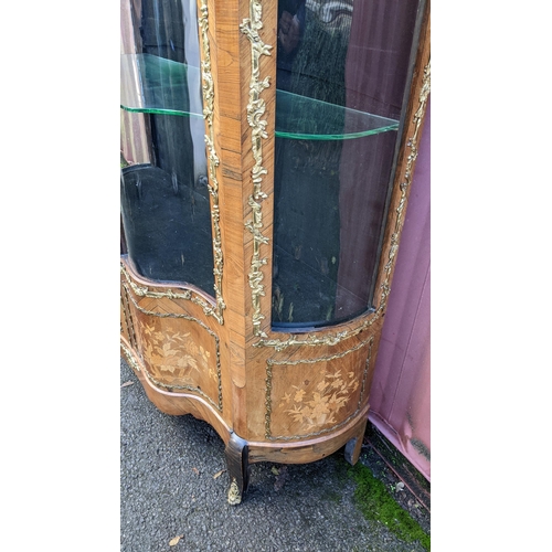 236 - A 19th century French Louis XV style kingwood vitrine display cabinet, serpentine fronted with twin ... 