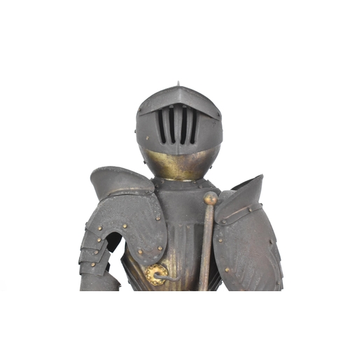 247 - A late 19th century small scale model of an articulated suit of armour, standing with a sword and mo... 