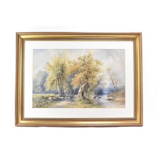 253 - Smythe - A late 19th/early 20th watercolour landscape scene depicting cows in a river and a shepherd... 