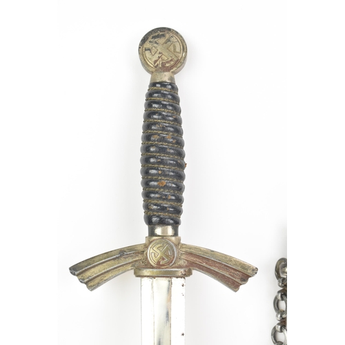 261 - A German WWII Luftwaffe 1st pattern parade dagger, having a Swastika globe pommel, wire wrapped cell... 