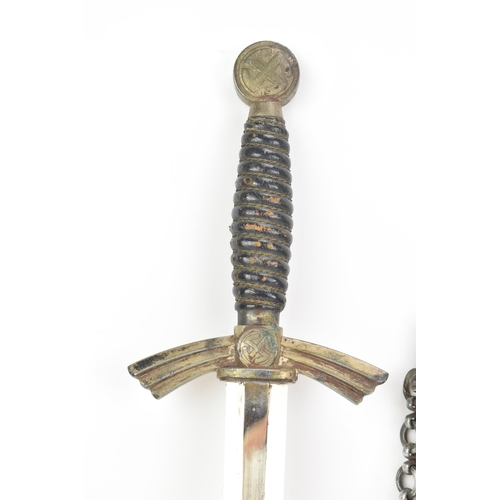 261 - A German WWII Luftwaffe 1st pattern parade dagger, having a Swastika globe pommel, wire wrapped cell... 