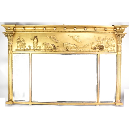 264 - A late 19th/early 20th century gilt overmantle triple-plate mirror, the frieze decorated with a depi... 