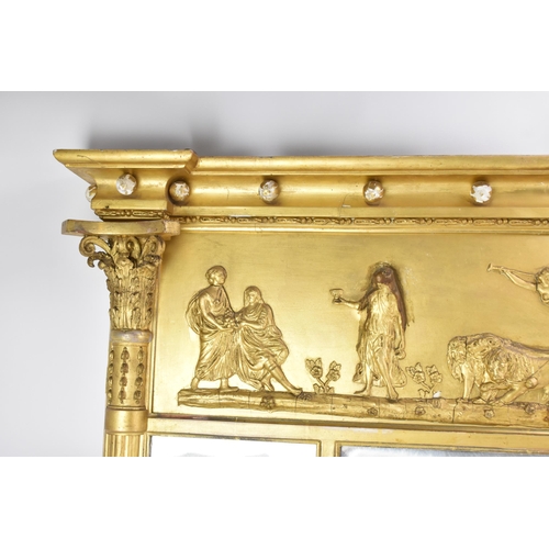 264 - A late 19th/early 20th century gilt overmantle triple-plate mirror, the frieze decorated with a depi... 