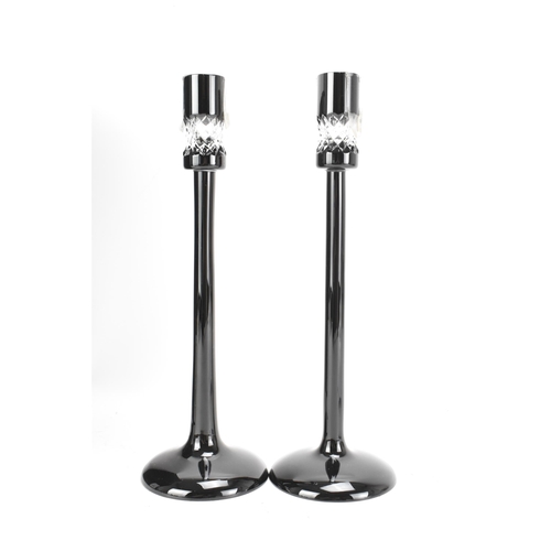 32 - A pair of Waterford black lead crystal cut candlesticks, designed by John Rocha, each of tapered for... 