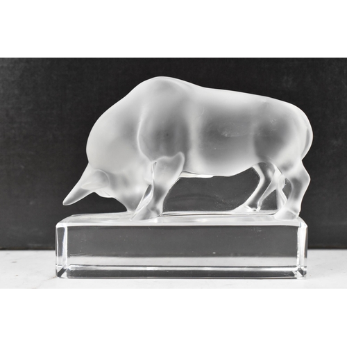 35 - A Lalique frosted glass paperweight fashioned as bull raised on a base, signed 'Lalique France' to t... 