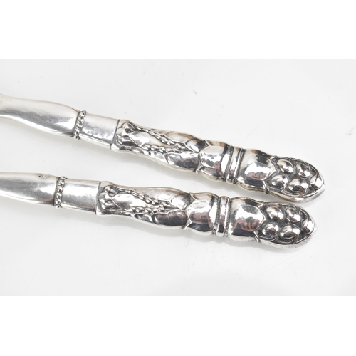 68 - A pair of Georg Jensen Danish sterling silver salad servers, import marks for London 1932, model no.... 