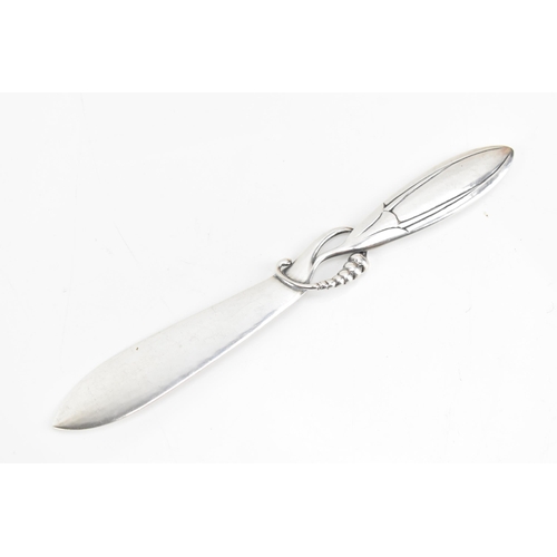 69 - A Georg Jensen Danish 925 silver paper knife, import marks for London 1927, model no. 117, in the 'M... 