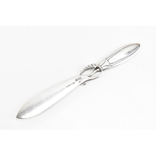 69 - A Georg Jensen Danish 925 silver paper knife, import marks for London 1927, model no. 117, in the 'M... 