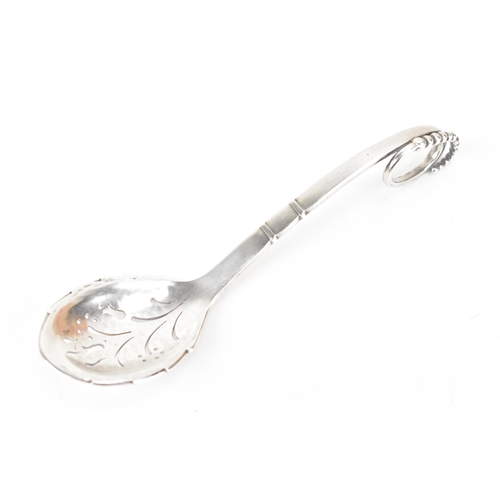 70 - A Georg Jensen Danish sterling silver sifter spoon, import marks for London 1932, model no. 239, hav... 