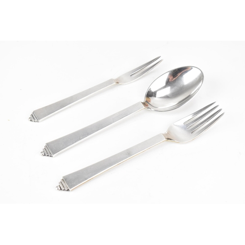 72 - An Art Deco Georg Jensen Danish sterling silver fork, spoon and pickle fork, the fork and spoon havi... 