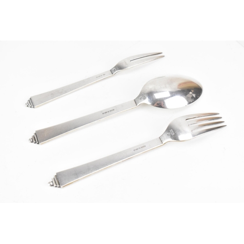 72 - An Art Deco Georg Jensen Danish sterling silver fork, spoon and pickle fork, the fork and spoon havi... 