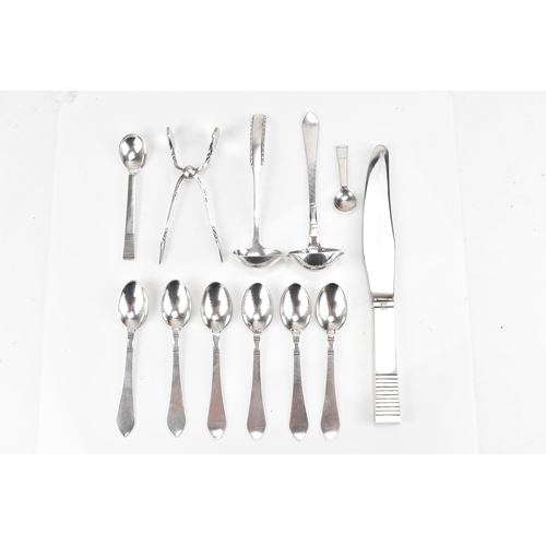 73 - A collection of early/mid 20th century Georg Jensen 925 silver cutlery, having various import marks,... 