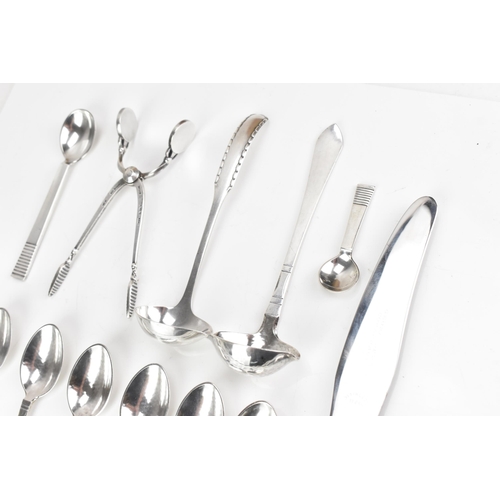 73 - A collection of early/mid 20th century Georg Jensen 925 silver cutlery, having various import marks,... 