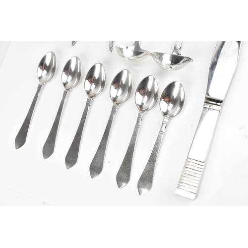 73 - A collection of early/mid 20th century Georg Jensen 925 silver cutlery, having various import marks,... 