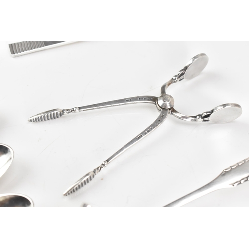 73 - A collection of early/mid 20th century Georg Jensen 925 silver cutlery, having various import marks,... 