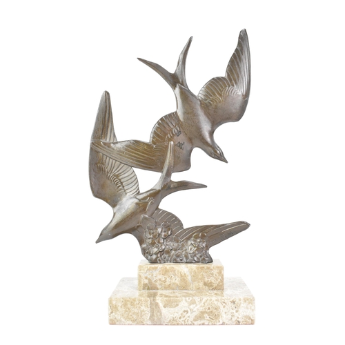 8 - An Art Deco bronze effect sculpture of two birds in flight, mounted on a stepped marble base, signed... 