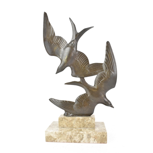 8 - An Art Deco bronze effect sculpture of two birds in flight, mounted on a stepped marble base, signed... 