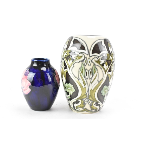 82 - Two Moorcroft pottery vases to include a trial piece 'Burslem Twilight' pattern vase, designed by An... 