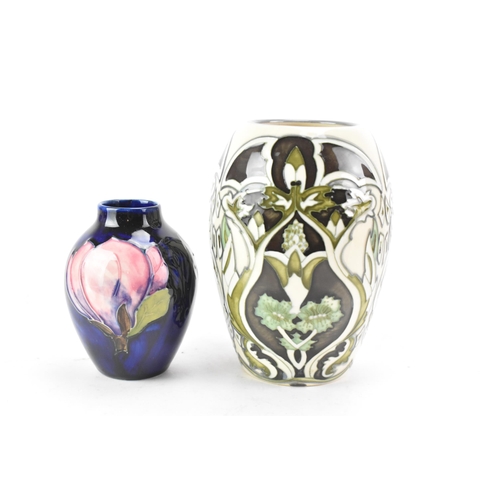 82 - Two Moorcroft pottery vases to include a trial piece 'Burslem Twilight' pattern vase, designed by An... 