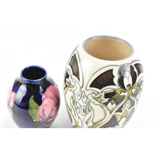 82 - Two Moorcroft pottery vases to include a trial piece 'Burslem Twilight' pattern vase, designed by An... 