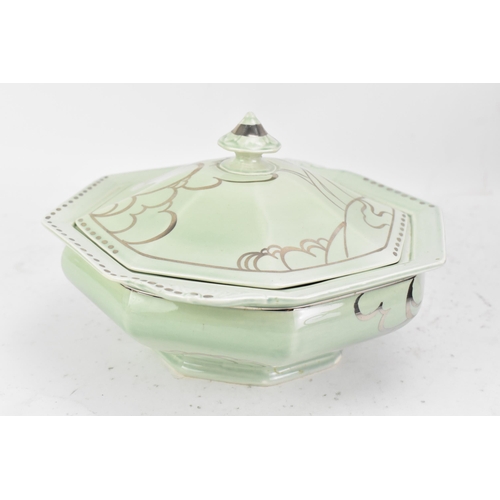 87 - An Art Deco Clarice Cliff Bizarre tureen, of octagonal form, hand painted in silver lustre over a gr... 