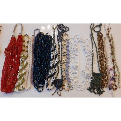 72 - Vintage fine bead necklaces to include a red bead multi chain example, a tiger's eye example and 2 w... 