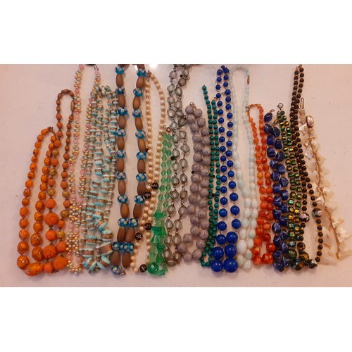 73 - A quantity of stone pendants, stone and painted glass bead necklaces to include lapis lazuli beads a... 