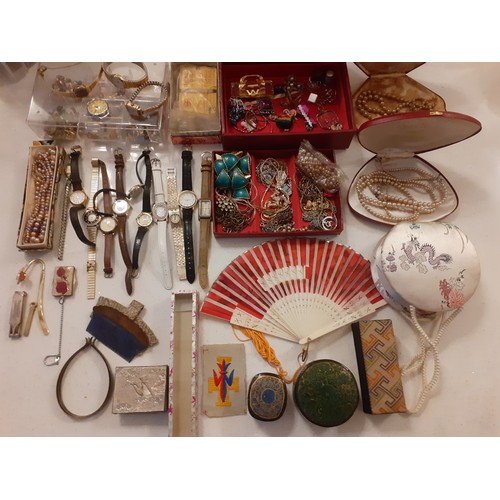 74 - Mixed costume jewellery to include a red jewellery box containing gold tone and silver tone chains t... 