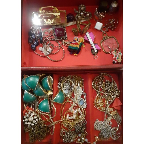 74 - Mixed costume jewellery to include a red jewellery box containing gold tone and silver tone chains t... 