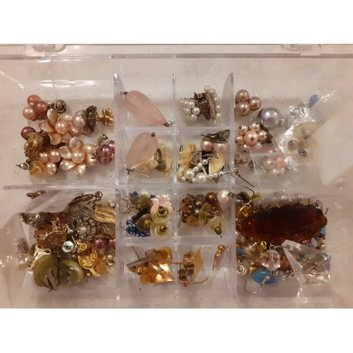 74 - Mixed costume jewellery to include a red jewellery box containing gold tone and silver tone chains t... 