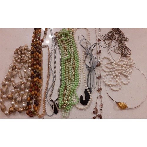 76 - A large quantity of vintage bead necklaces to include Aurora Borealis examples and simulated pearls ... 