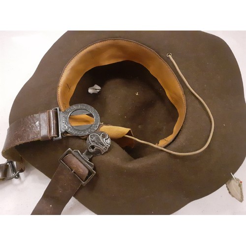 89 - Boy Scout interest- A 1960's brown felt hat, 2 leather belts, various cloth badges and a quantity of... 