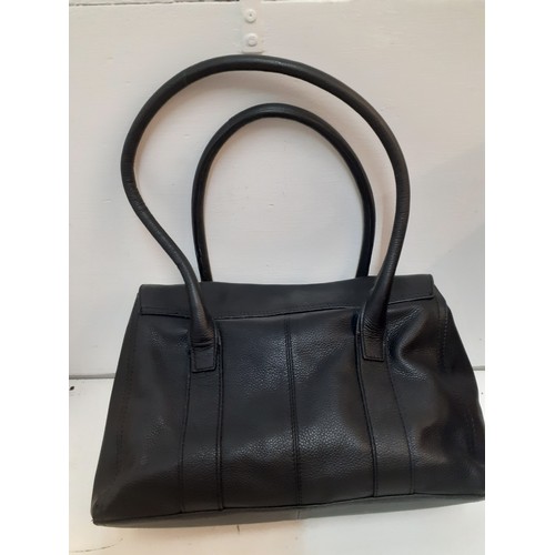 66 - A Marks and Spencers black textured leather bag, un-used with original tags, a pair of ladies Clarks... 