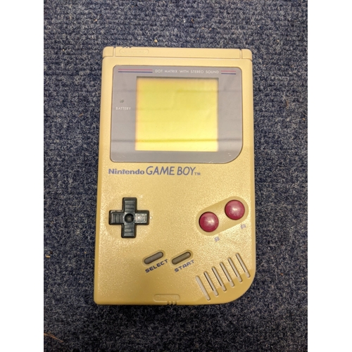 49 - A Nintendo Game Boy compact video game system in original box along with six cased games - super Mar... 