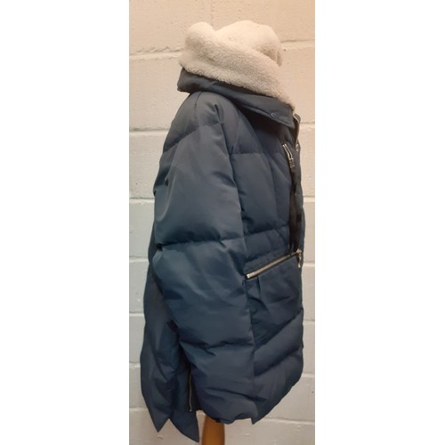 105 - Orolay- A ladies duck and feather down hooded and waterproof jacket  in navy with silver tone zipper... 