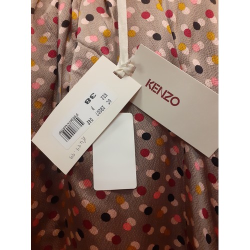 4 - Kenzo- A ladies silk dress in taupe with multi-coloured dot design, short sleeves with black trim an... 