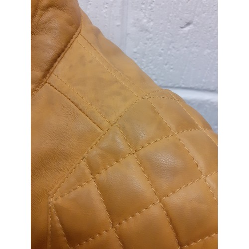 111 - Joe Brown- A mustard yellow biker style leather effect jacket, size large together with a James Lake... 