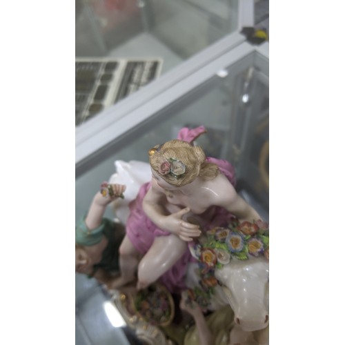 179 - A late 19th century Meissen porcelain figure of Europa and the Bull, accompanied by two kneeling nym... 