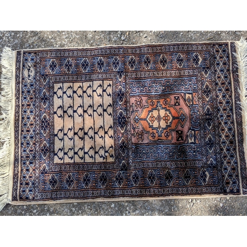 102 - Two Pakistan Bokhara rugs largest 188cms & 121cms and a geometric wool rug
Location: STAIRS
If there... 