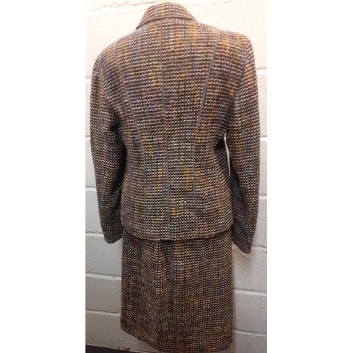 13 - Feraud- A vintage 2 piece boucle/tweed skirt suit having a lilac lining, European size 40 together w... 