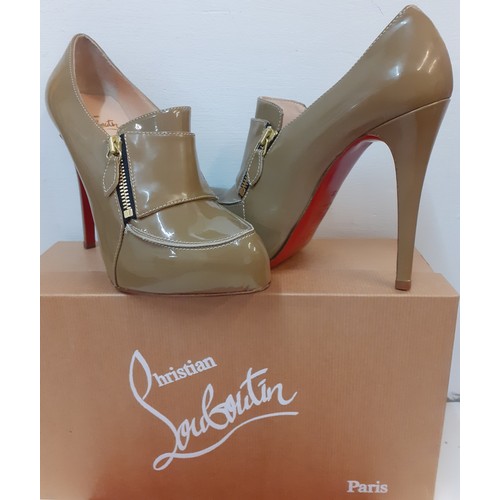 Christian Laboutin-A pair of unworn taupe Lapono patent stilettos having a 5" heel, iconic red soles and zip detail to front, European size 38, with branded red dust bag, box and original receipt (rrp £360). Location:
Condition:Unworn, as new, no mini red bag containing heel tip replacements