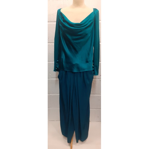 15 - Yves Saint Laurent, French designer- A Saint Laurent Rive Gauche green/teal silk blouse having zippe... 