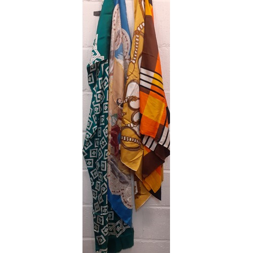 86 - A group of vintage silk scarves to include an Aquascutum green and white example and a Paco Rabanne ... 