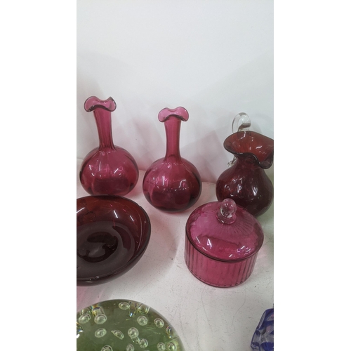 106 - Glassware to include a Victorian clump weight a pair of 19th century cranberry glass vases and other... 