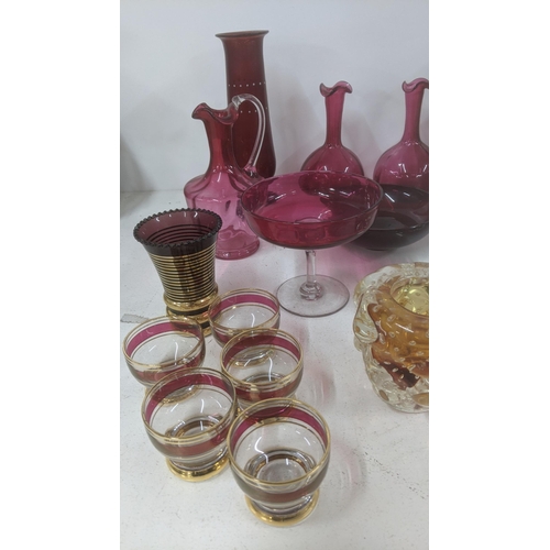 106 - Glassware to include a Victorian clump weight a pair of 19th century cranberry glass vases and other... 