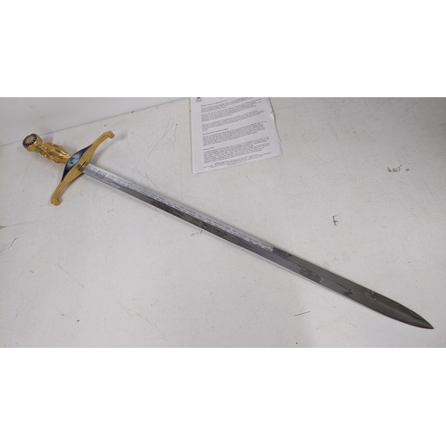 18 - A Wilkinson commemorative Millennium sword, the gilt handle cast as the three grace, enamel decorati... 