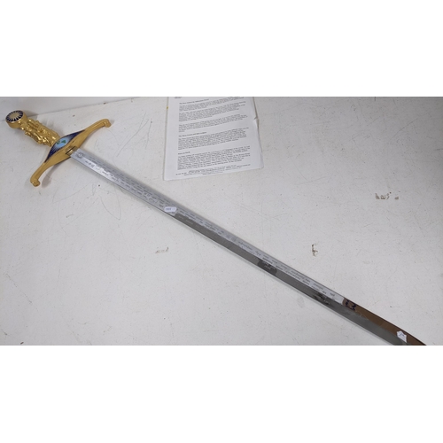 18 - A Wilkinson commemorative Millennium sword, the gilt handle cast as the three grace, enamel decorati... 