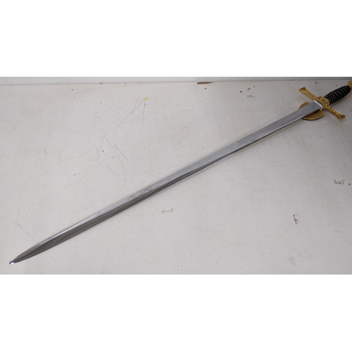 19 - A Wilkinson modern sword, having a leather grip with wire banding, gilt cross guard and with an enam... 